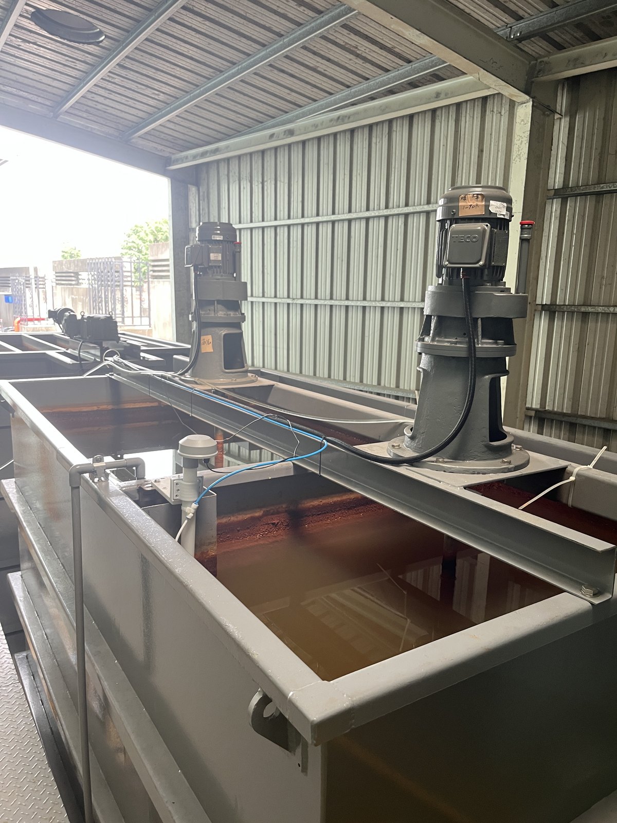 Flash and slow mixing basins in an industrial wastewater treatment plant