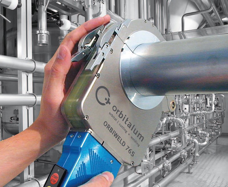 Orbital welding head joining sanitary stainless steel process piping